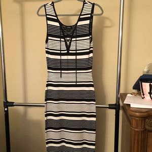 This is a long stripped tight fitted dress.